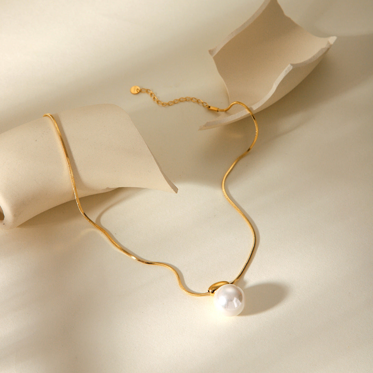 Simple and versatile golden bean necklace with stainless steel French style small fragrance pearl pendant jewelry
