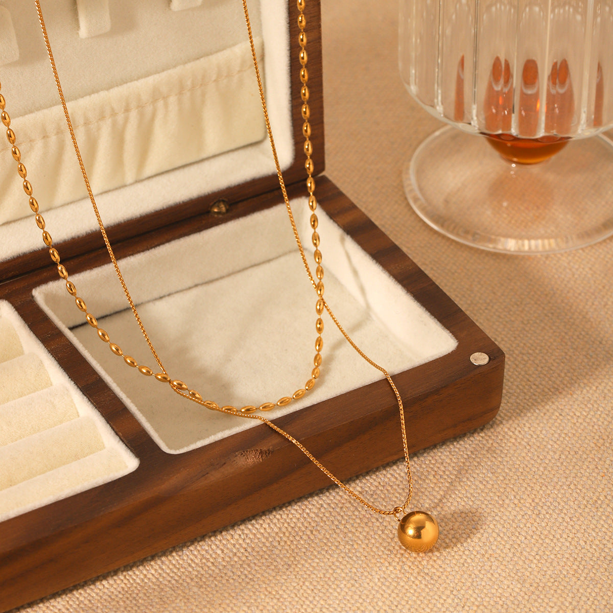 Double-layer stainless steel necklace, oval bead chain, Fried Dough Twists chain, small golden ball pendant, neck chain, titanium steel necklace accessory, does not fade