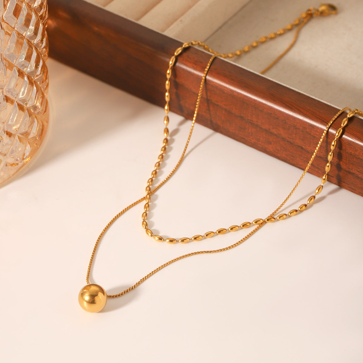 Double-layer stainless steel necklace, oval bead chain, Fried Dough Twists chain, small golden ball pendant, neck chain, titanium steel necklace accessory, does not fade