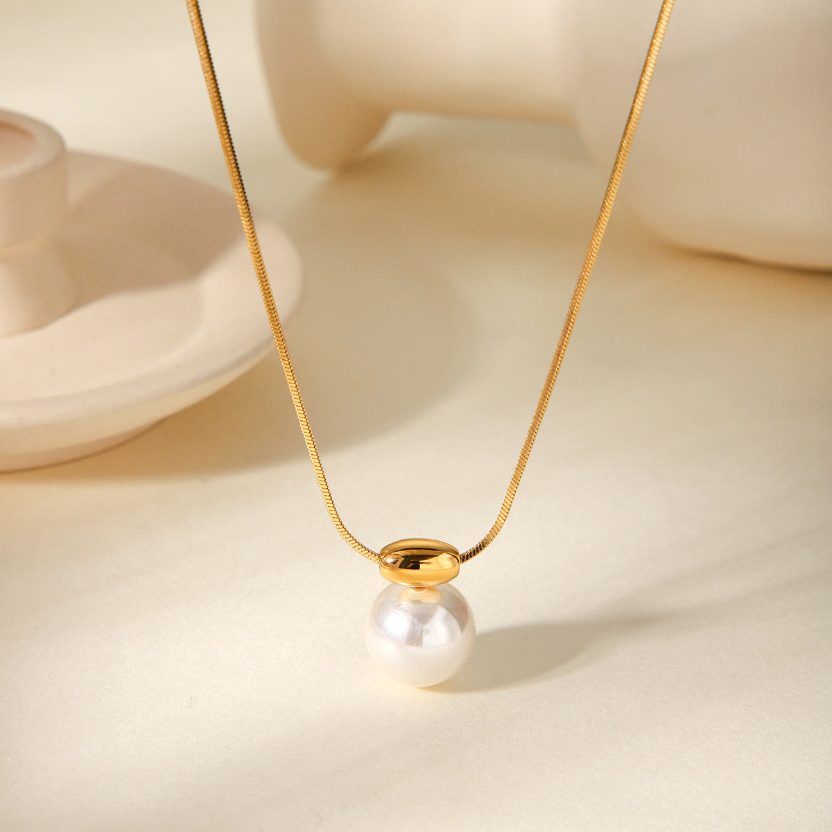 Simple and versatile golden bean necklace with stainless steel French style small fragrance pearl pendant jewelry