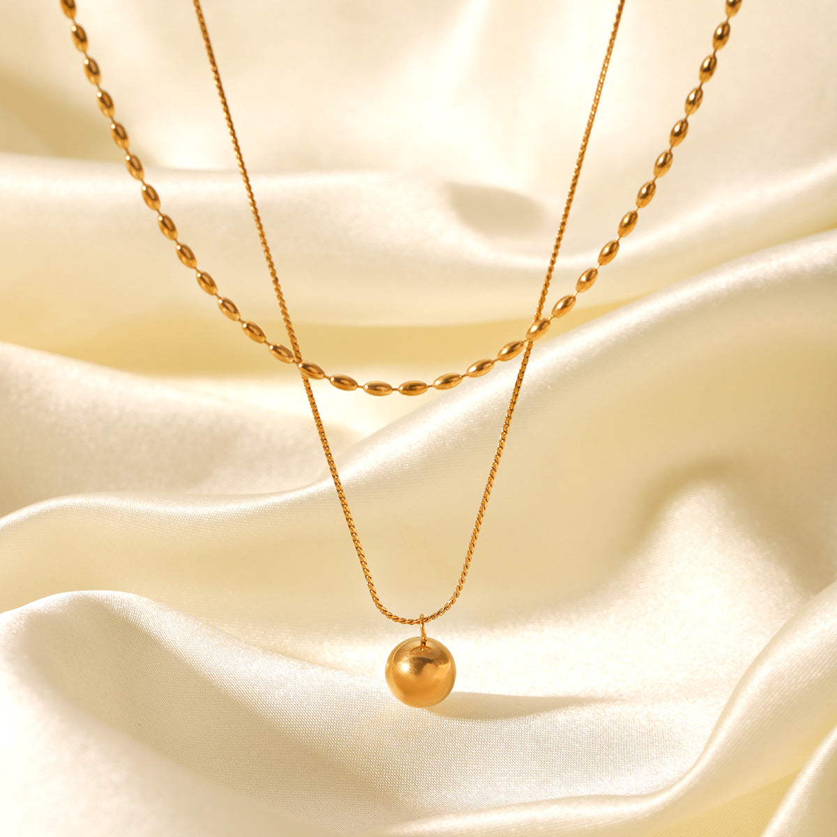 Double-layer stainless steel necklace, oval bead chain, Fried Dough Twists chain, small golden ball pendant, neck chain, titanium steel necklace accessory, does not fade