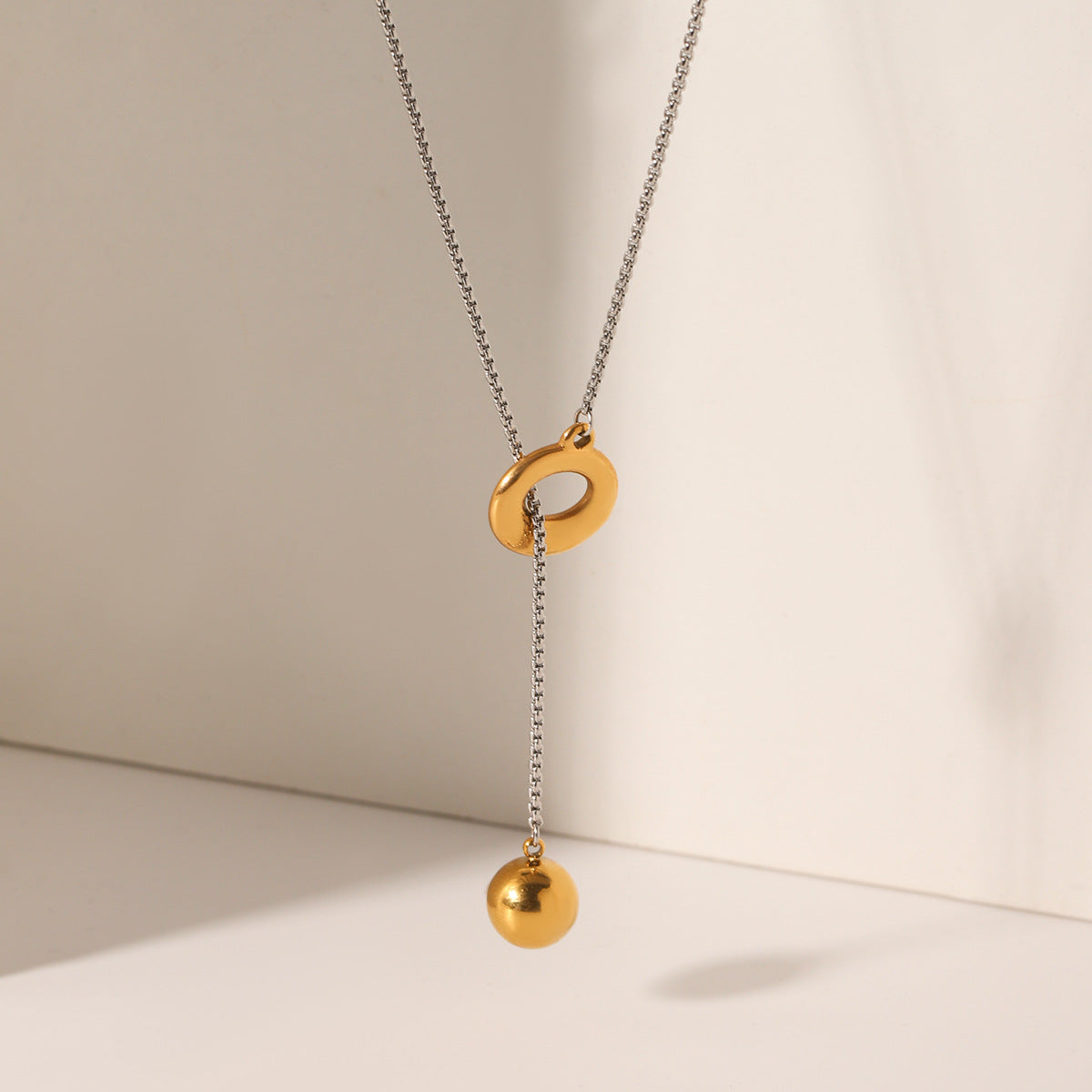 Gold and Silver Color-blocked Stainless Steel Ring Buckle Spherical Pendant Necklace for Women, Niche Design, Titanium Steel Sweater Chain Necklace Accessory