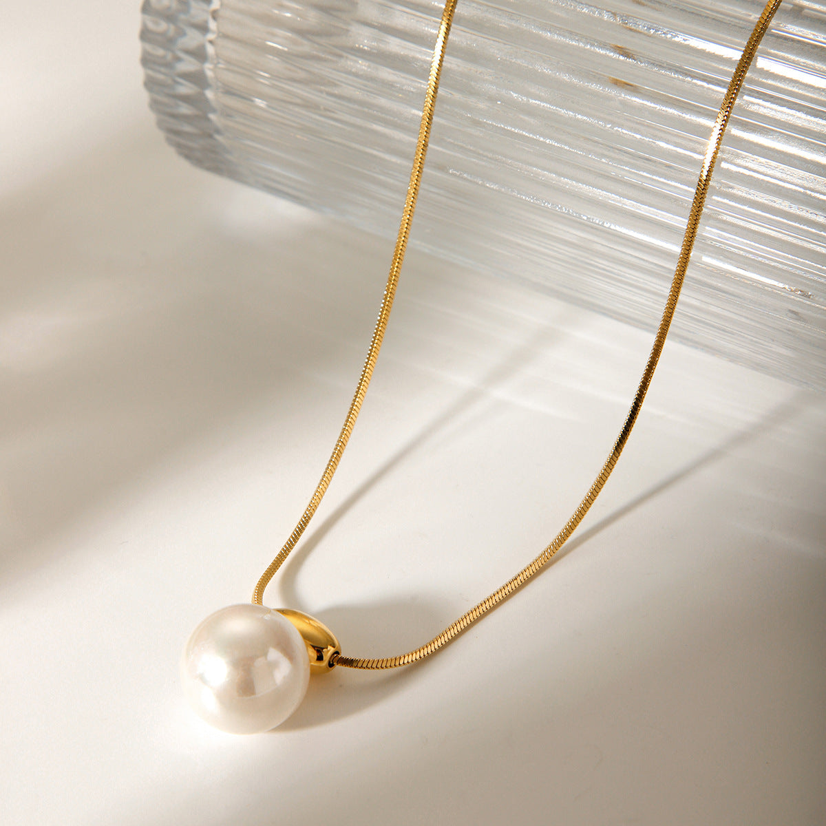 Simple and versatile golden bean necklace with stainless steel French style small fragrance pearl pendant jewelry